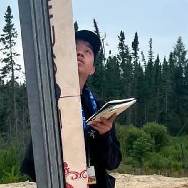 Daniel C. Mao on the launch pad beside a competition rocket